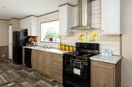 The THE RANCH HOUSE Kitchen. This Manufactured Mobile Home features 3 bedrooms and 2 baths.