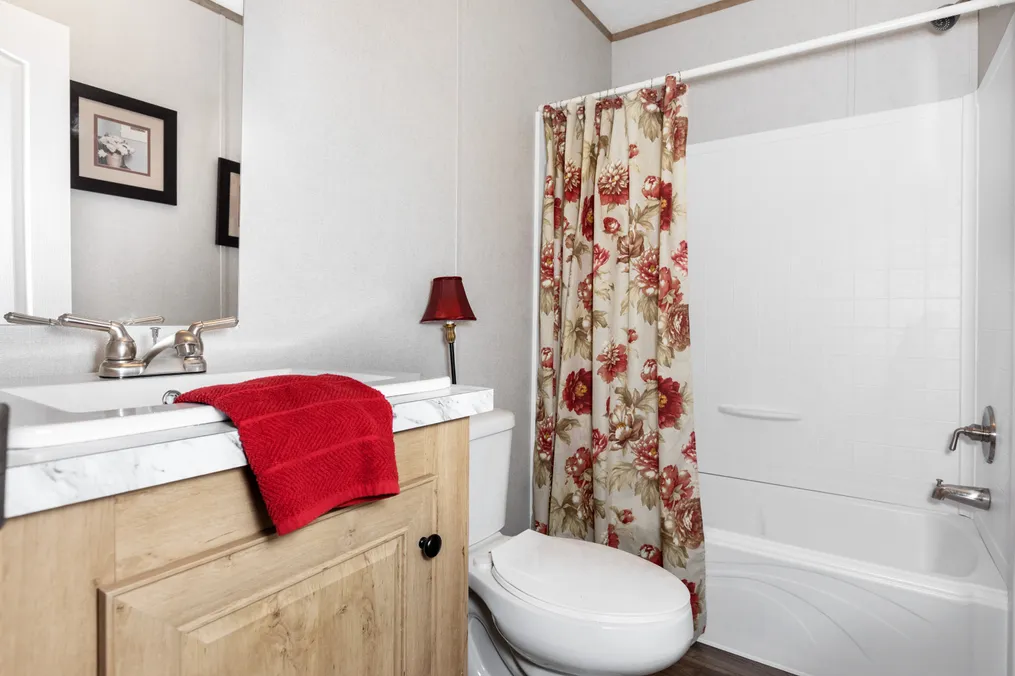 The BLAZER 76 C Guest Bathroom. This Manufactured Mobile Home features 3 bedrooms and 2 baths.