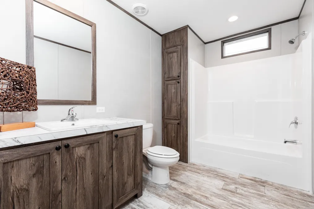 The KING AIR Guest Bathroom. This Manufactured Mobile Home features 4 bedrooms and 2 baths.