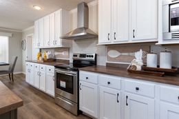 The REMINGTON Kitchen. This Manufactured Mobile Home features 3 bedrooms and 2 baths.