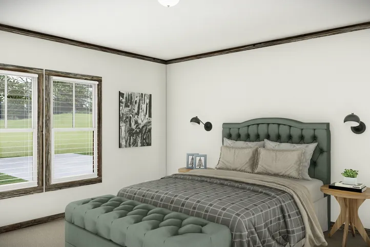 The THE SUMNER Primary Bedroom. This Manufactured Mobile Home features 3 bedrooms and 2 baths.