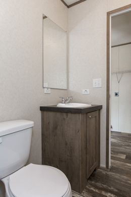 The THE NEW BREEZE I Guest Bathroom. This Manufactured Mobile Home features 3 bedrooms and 2 baths.