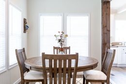 The SOUTHERN CHARM 4 BR Dining Room. This Manufactured Mobile Home features 4 bedrooms and 2 baths.