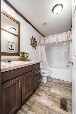 The THE TURNER Guest Bathroom. This Manufactured Mobile Home features 3 bedrooms and 2 baths.