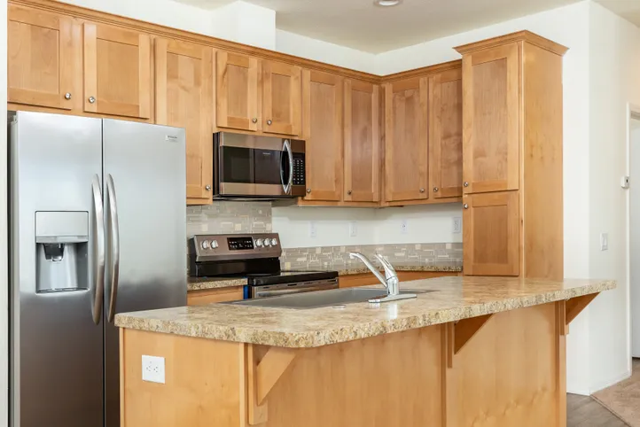 The FAIRPOINT 20523B Kitchen. This Manufactured Mobile Home features 3 bedrooms and 2 baths.