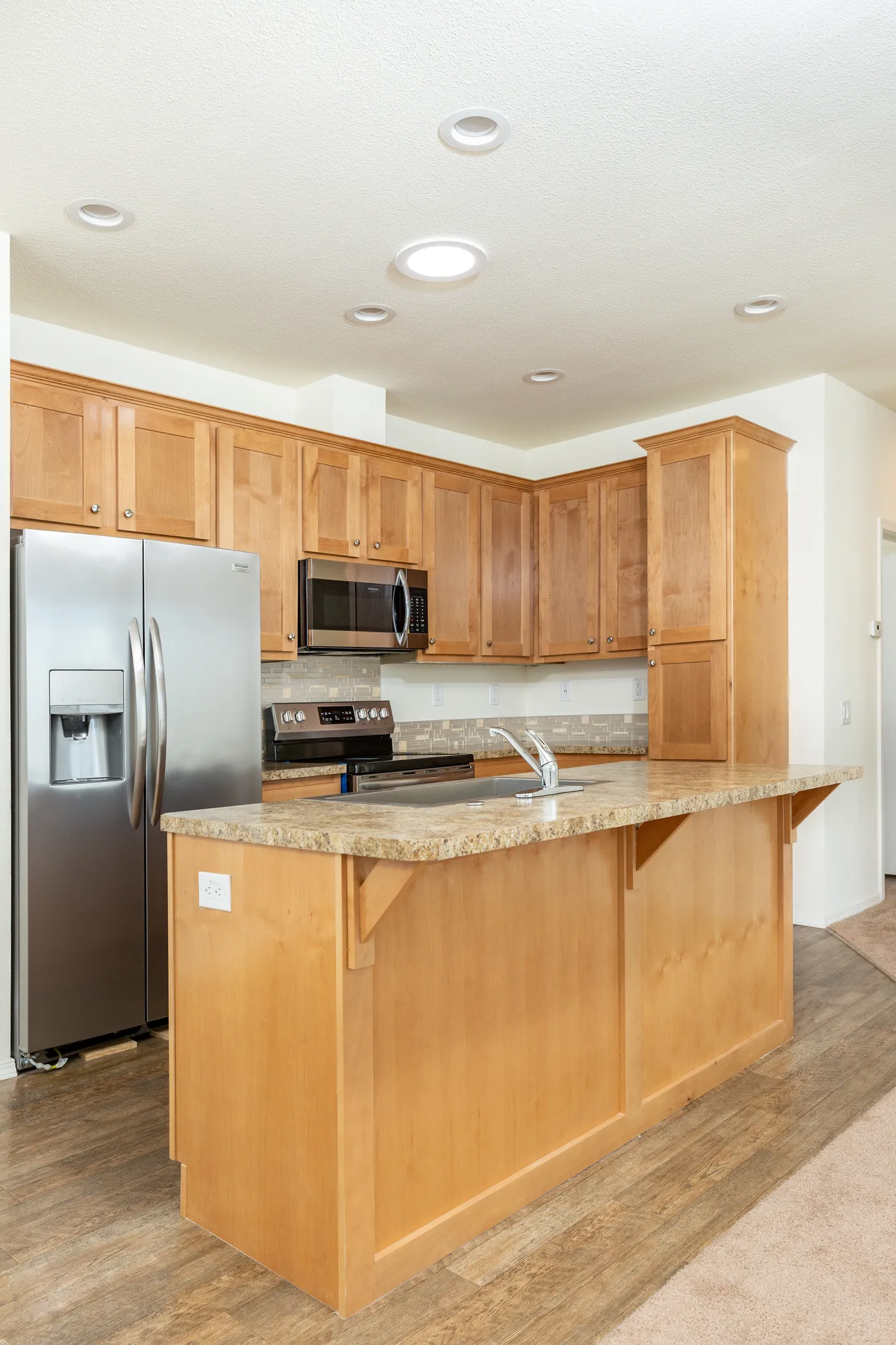 The FAIRPOINT 20523B Kitchen. This Manufactured Mobile Home features 3 bedrooms and 2 baths.