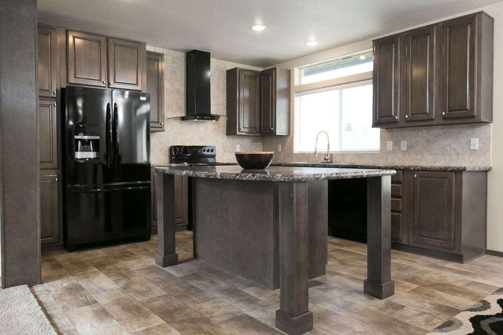 The 2023 COLUMBIA RIVER Kitchen. This Manufactured Mobile Home features 3 bedrooms and 2 baths.