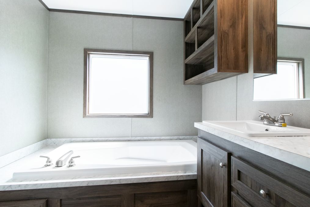 The THE ANNIVERSARY SPLASH Master Bathroom. This Manufactured Mobile Home features 3 bedrooms and 2 baths.
