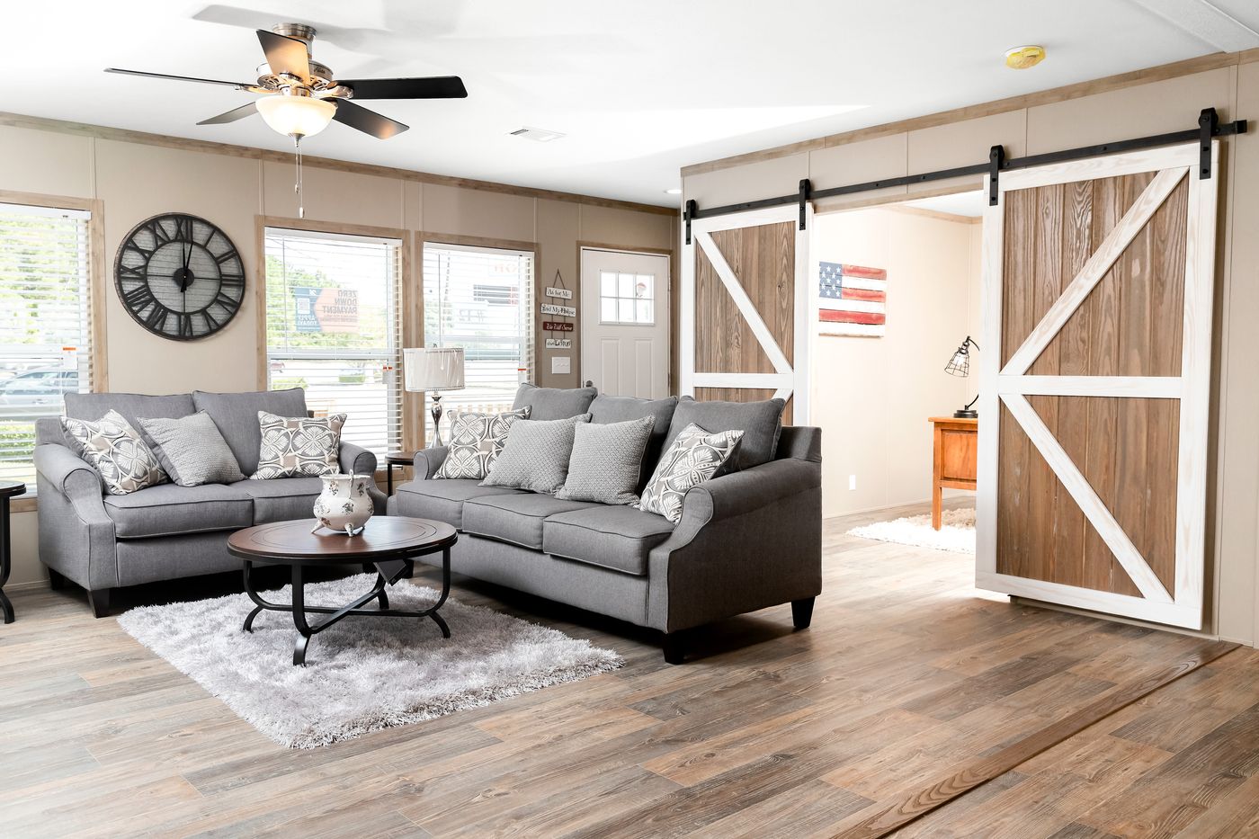 The FARMHOUSE FLEX Living Room. This Manufactured Mobile Home features 3 bedrooms and 2.5 baths.
