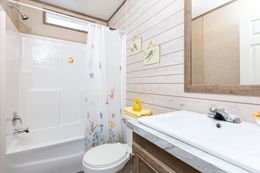 The THE RANCH HOUSE Guest Bathroom. This Manufactured Mobile Home features 3 bedrooms and 2 baths.