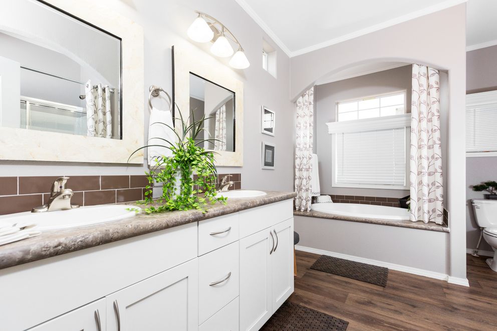 The ENCHANTMENT 3070A Primary Bathroom. This Manufactured Mobile Home features 3 bedrooms and 2 baths.