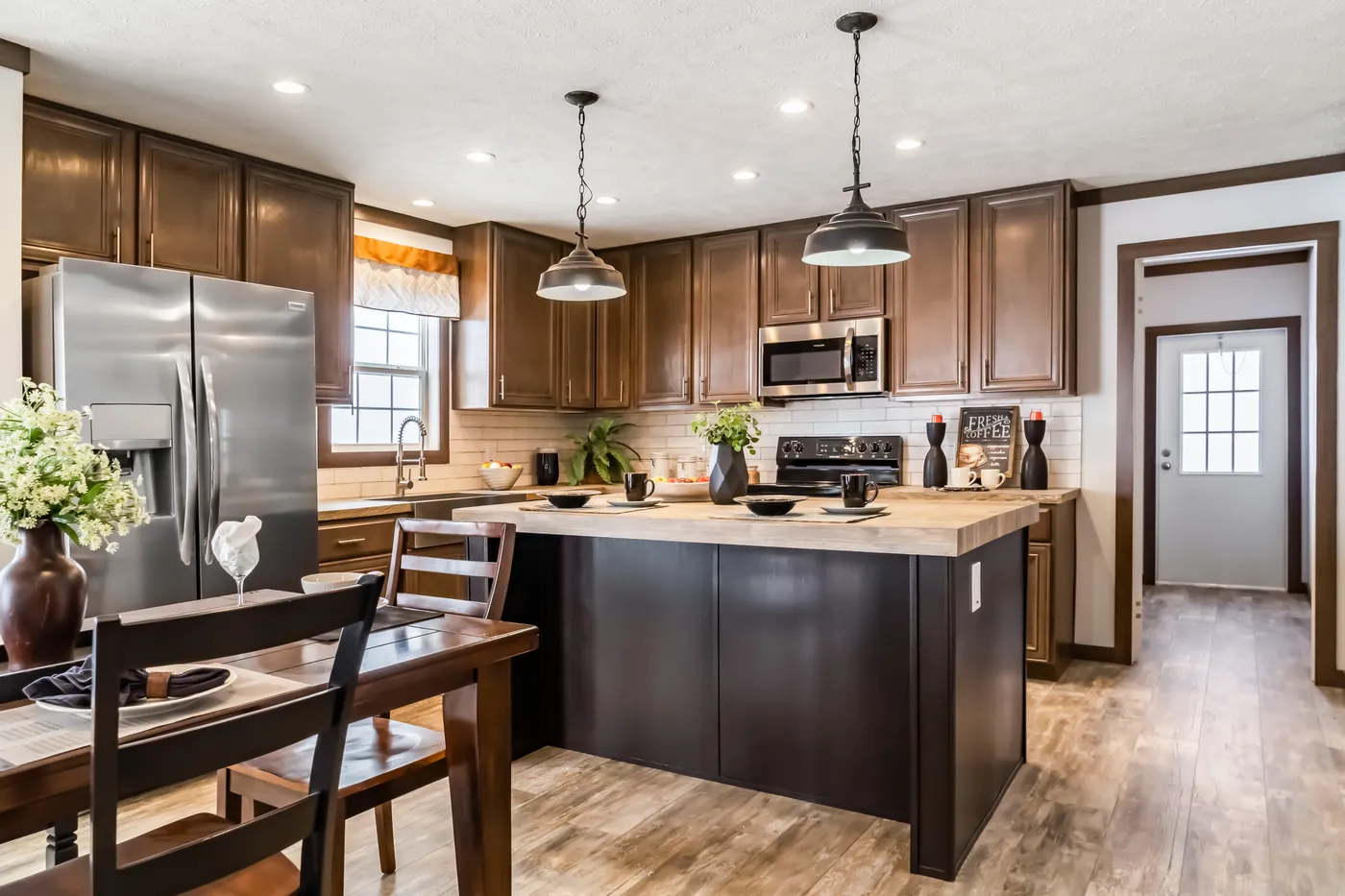 The THE TURNER Kitchen. This Manufactured Mobile Home features 3 bedrooms and 2 baths.