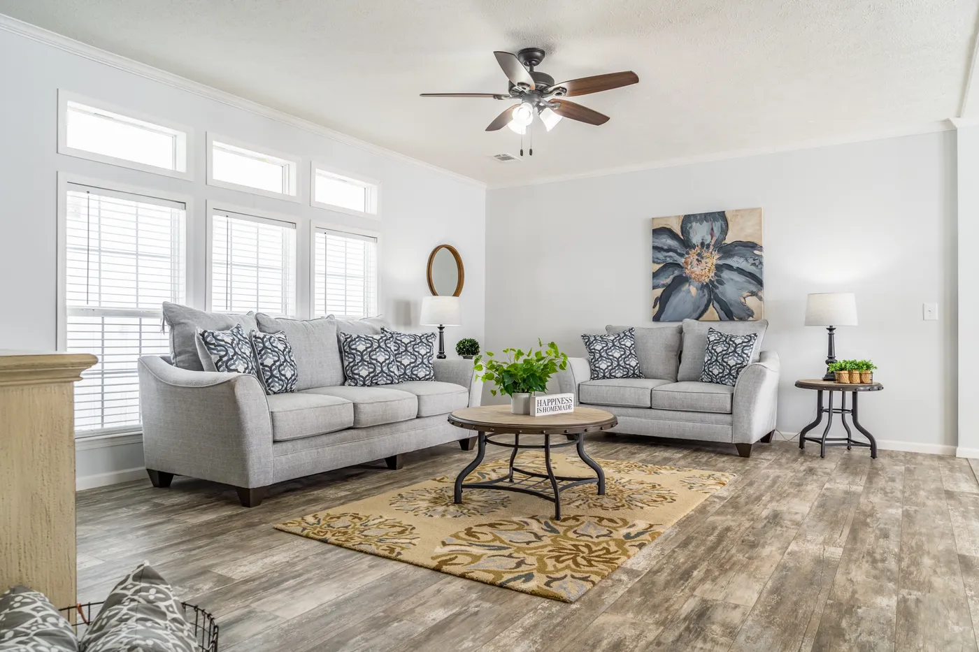 The THE INGRAM Living Room. This Manufactured Mobile Home features 3 bedrooms and 2 baths.