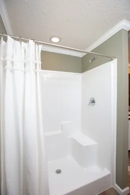 The KEENELAND Primary Bathroom. This Manufactured Mobile Home features 3 bedrooms and 2 baths.