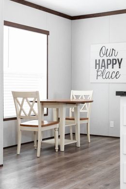 The THE POWERHOUSE Dining Area. This Manufactured Mobile Home features 3 bedrooms and 2 baths.