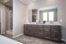 The THE HUXTON Guest Bathroom. This Manufactured Mobile Home features 4 bedrooms and 3 baths.