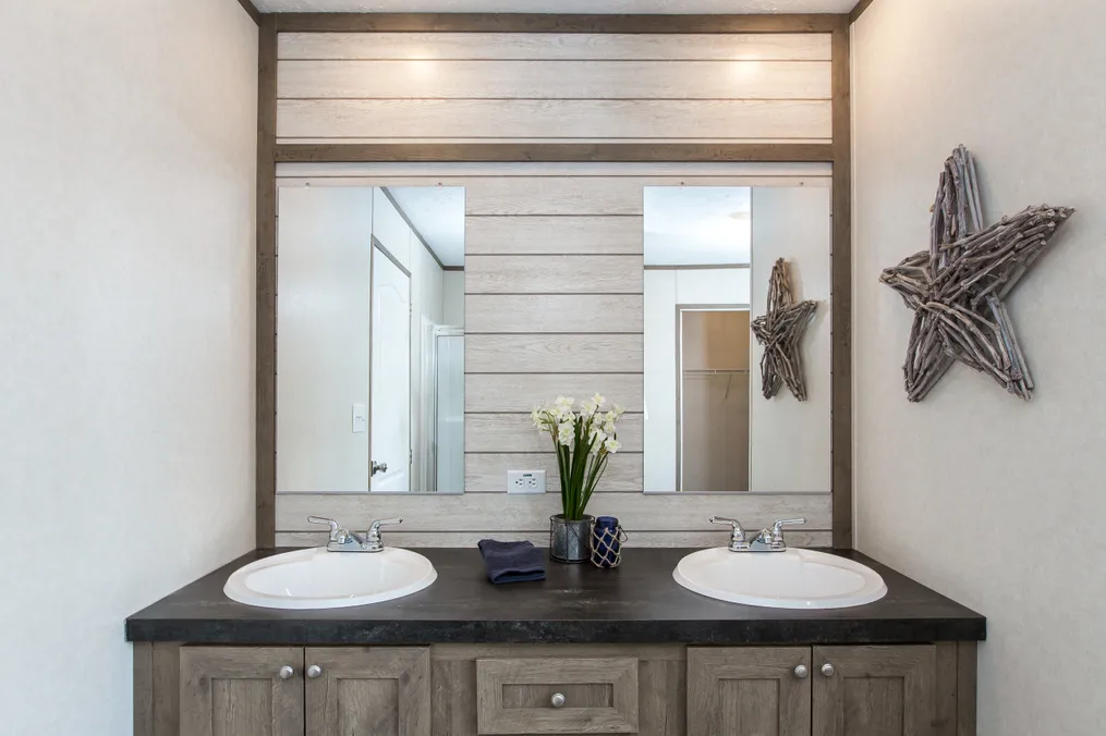 The THE BREEZE 2.5         CLAYTON Primary Bathroom. This Manufactured Mobile Home features 4 bedrooms and 2 baths.