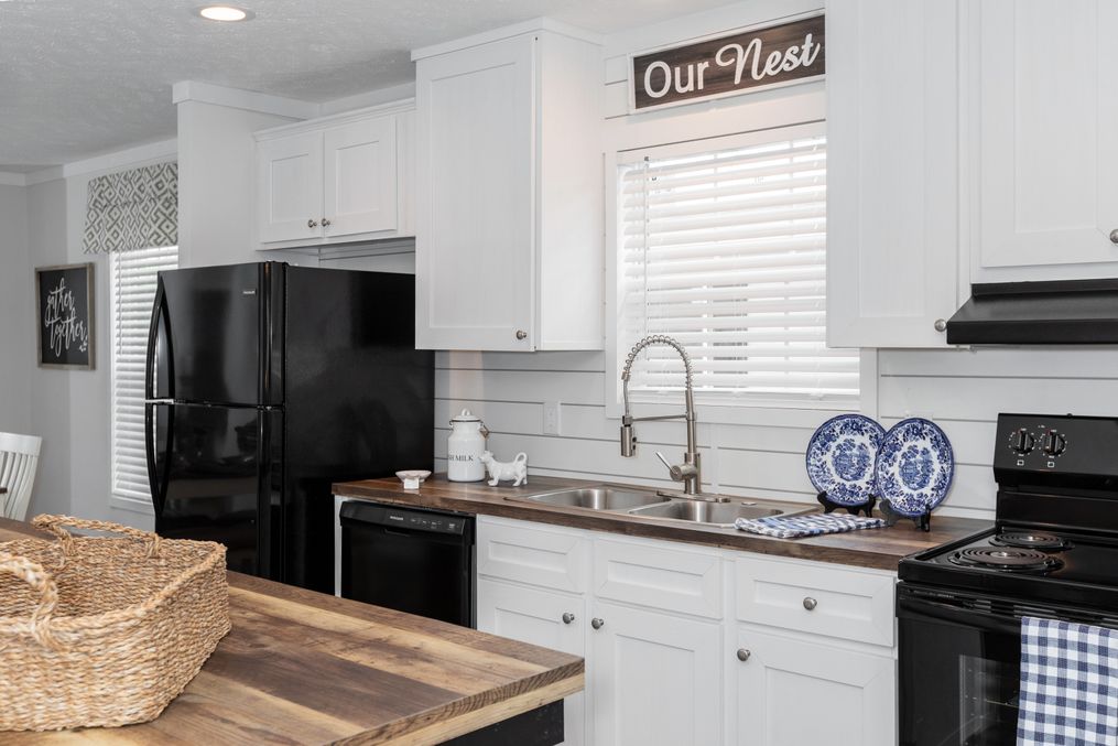 The ANSWER M375 Kitchen. This Manufactured Mobile Home features 4 bedrooms and 2 baths.