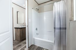 The THE BREEZE II Guest Bathroom. This Manufactured Mobile Home features 4 bedrooms and 2 baths.