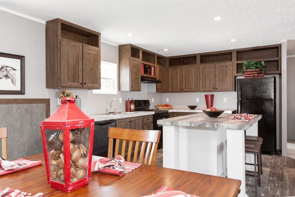 The TRADITION 52B Dining Area. This Manufactured Mobile Home features 3 bedrooms and 2 baths.