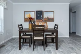 The THE FREEDOM BREEZE Dining Area. This Manufactured Mobile Home features 3 bedrooms and 2 baths.