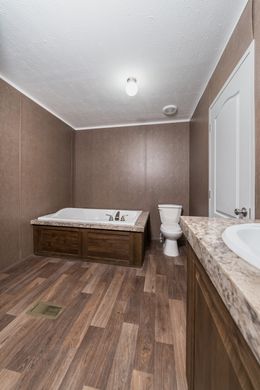 The TRADITION 3268B Master Bathroom. This Manufactured Mobile Home features 5 bedrooms and 3 baths.