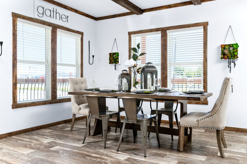 The THE DAISY-MAE Dining Area. This Manufactured Mobile Home features 3 bedrooms and 2 baths.
