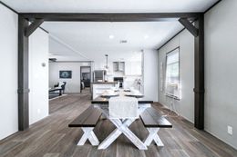 The ABSOLUTE VALUE Dining Room. This Manufactured Mobile Home features 4 bedrooms and 2 baths.