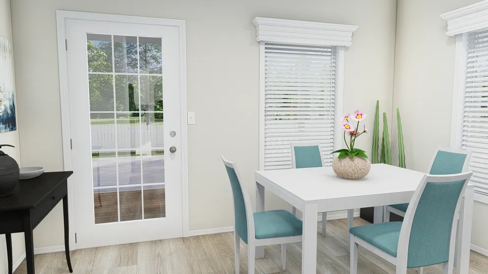 The K2750A Dining Area. This Manufactured Mobile Home features 3 bedrooms and 2 baths.