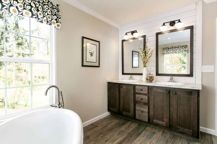 The FREEDOM FARM HOUSE  32X60 Primary Bathroom. This Manufactured Mobile Home features 3 bedrooms and 2 baths.