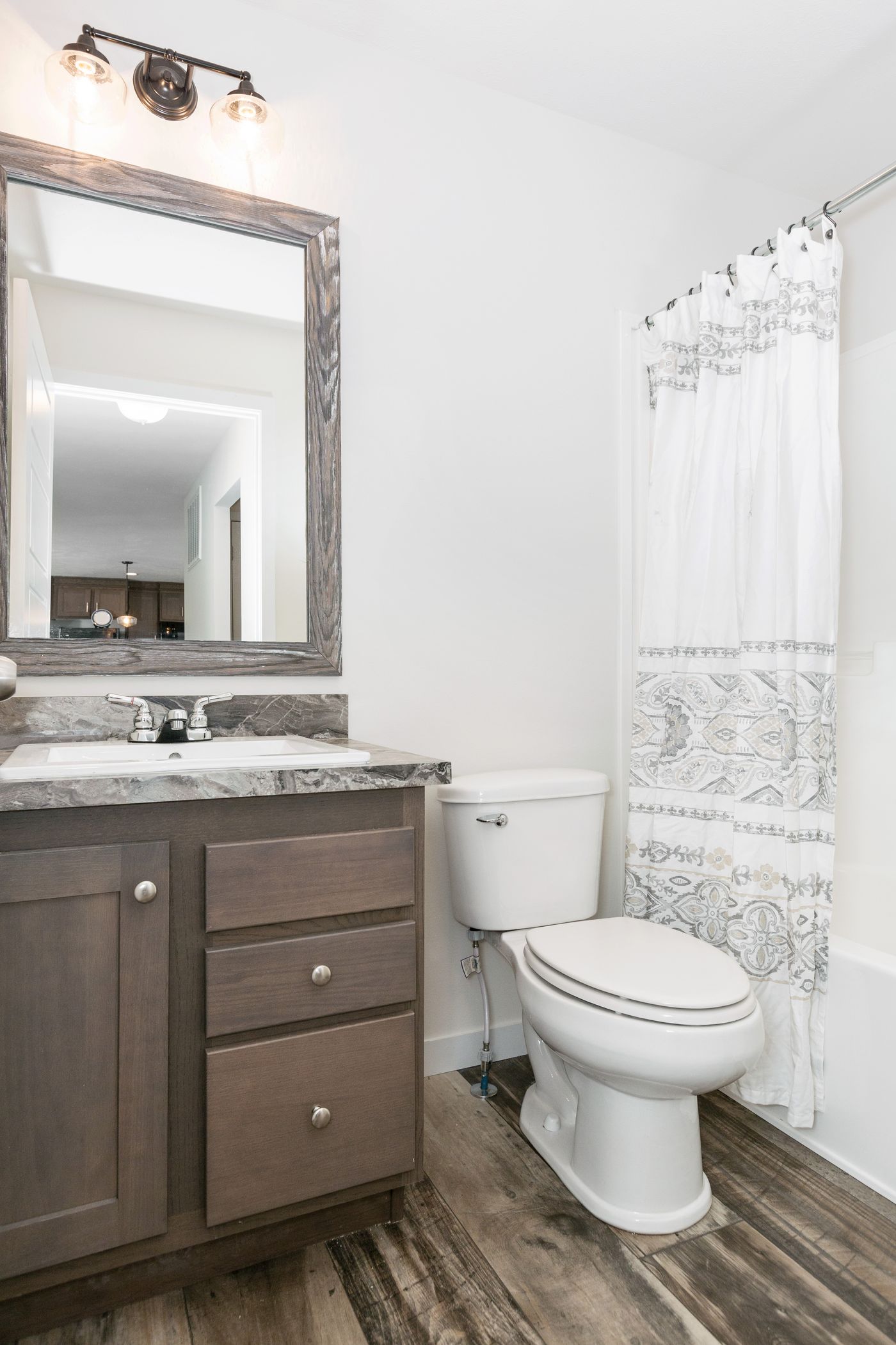 The LILAC PLACE 4028-MS044 SECT Guest Bathroom. This Manufactured Mobile Home features 2 bedrooms and 2 baths.