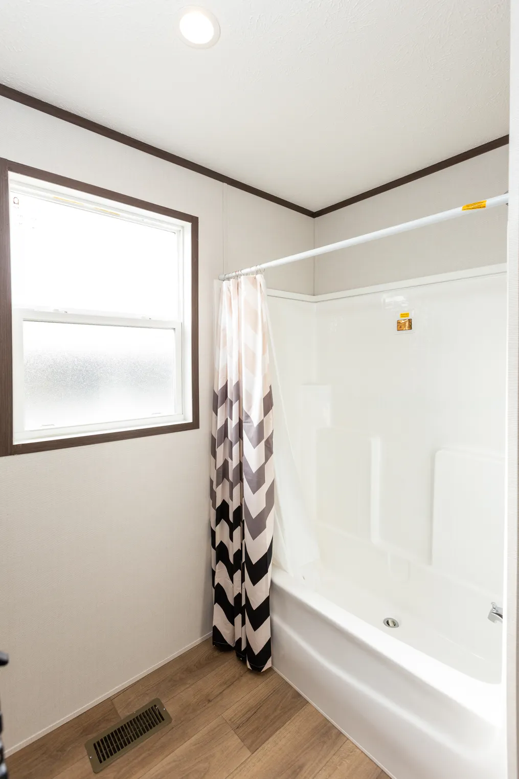 The THE HAMPTON BAY Guest Bathroom. This Manufactured Mobile Home features 3 bedrooms and 2 baths.
