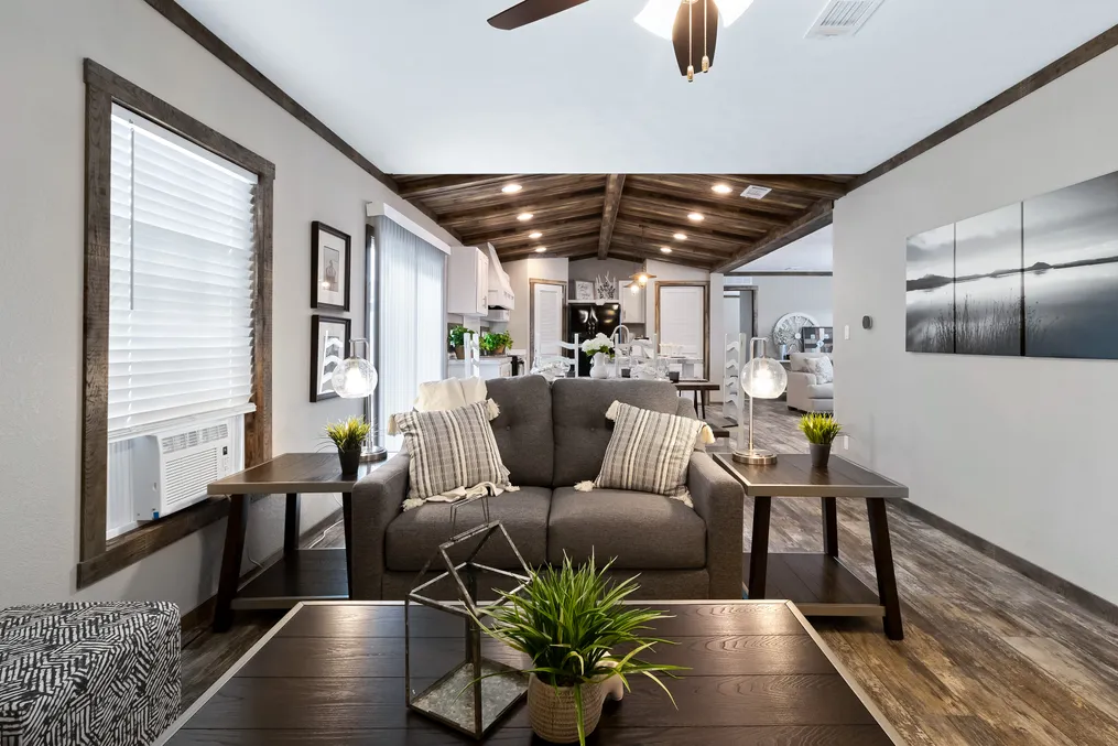 The THE MAVERICK Living Room. This Manufactured Mobile Home features 4 bedrooms and 2 baths.