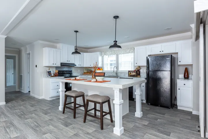 The THE FREEDOM BREEZE Kitchen. This Manufactured Mobile Home features 3 bedrooms and 2 baths.