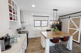 The BREEZE FARMHOUSE 72 Kitchen. This Manufactured Mobile Home features 4 bedrooms and 2 baths.