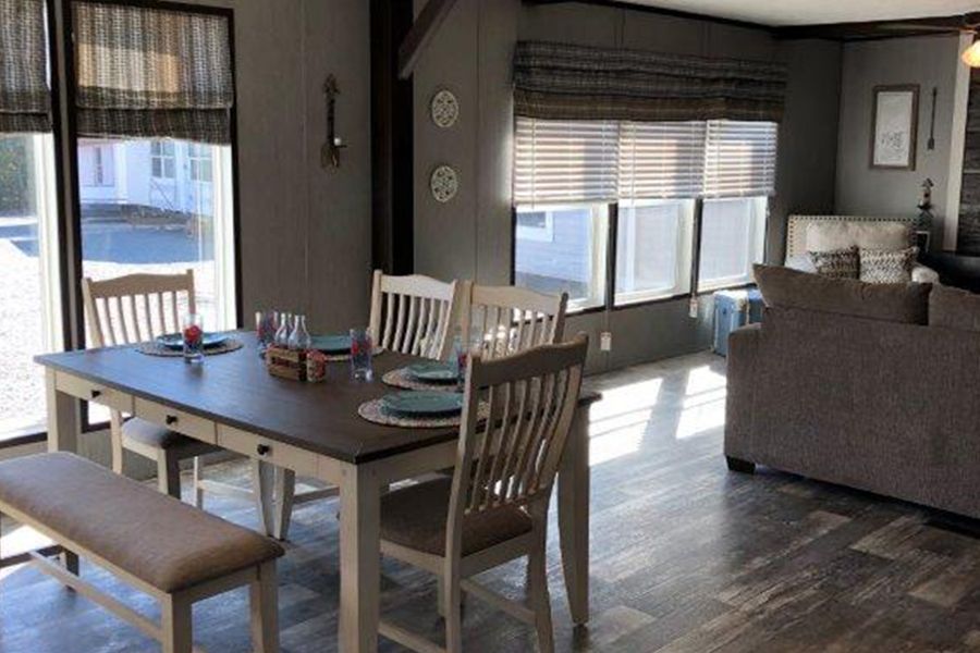 The THE MEADOWBROOK Dining Room. This Manufactured Mobile Home features 4 bedrooms and 2 baths.
