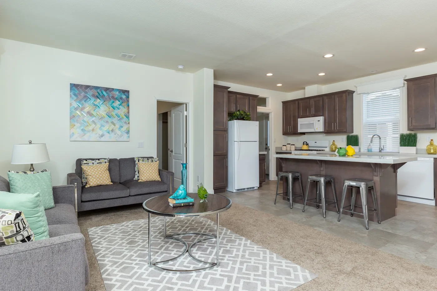 The FAIRPOINT 24564A Living Room. This Manufactured Mobile Home features 4 bedrooms and 2 baths.