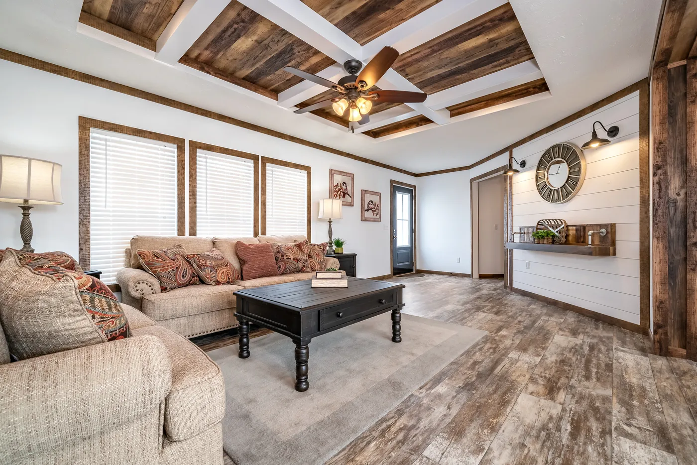 The THE AVALYN Living Room. This Manufactured Mobile Home features 3 bedrooms and 2 baths.