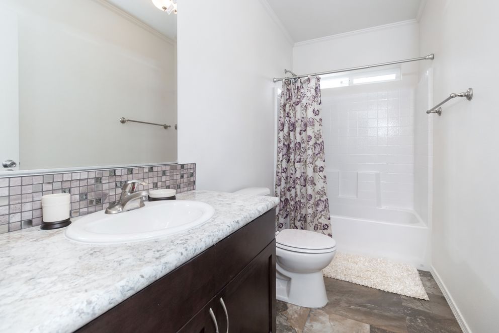 The K3060A Guest Bathroom. This Manufactured Mobile Home features 3 bedrooms and 2 baths.