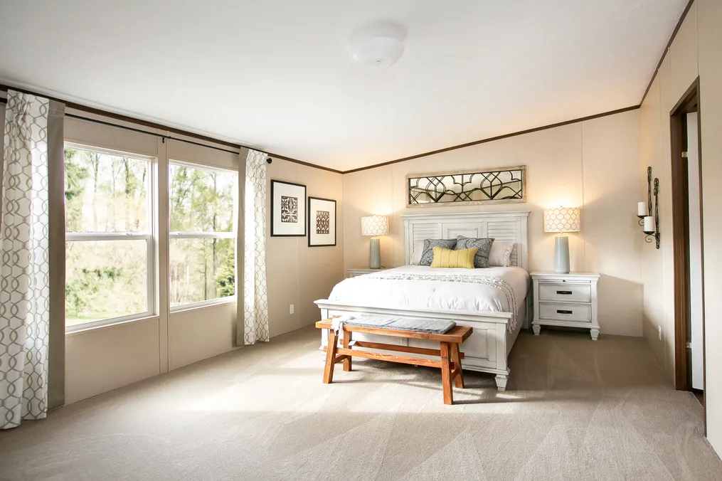 The TRIUMPH Primary Bedroom. This Manufactured Mobile Home features 5 bedrooms and 3 baths.