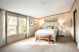 The TRIUMPH Primary Bedroom. This Manufactured Mobile Home features 5 bedrooms and 3 baths.