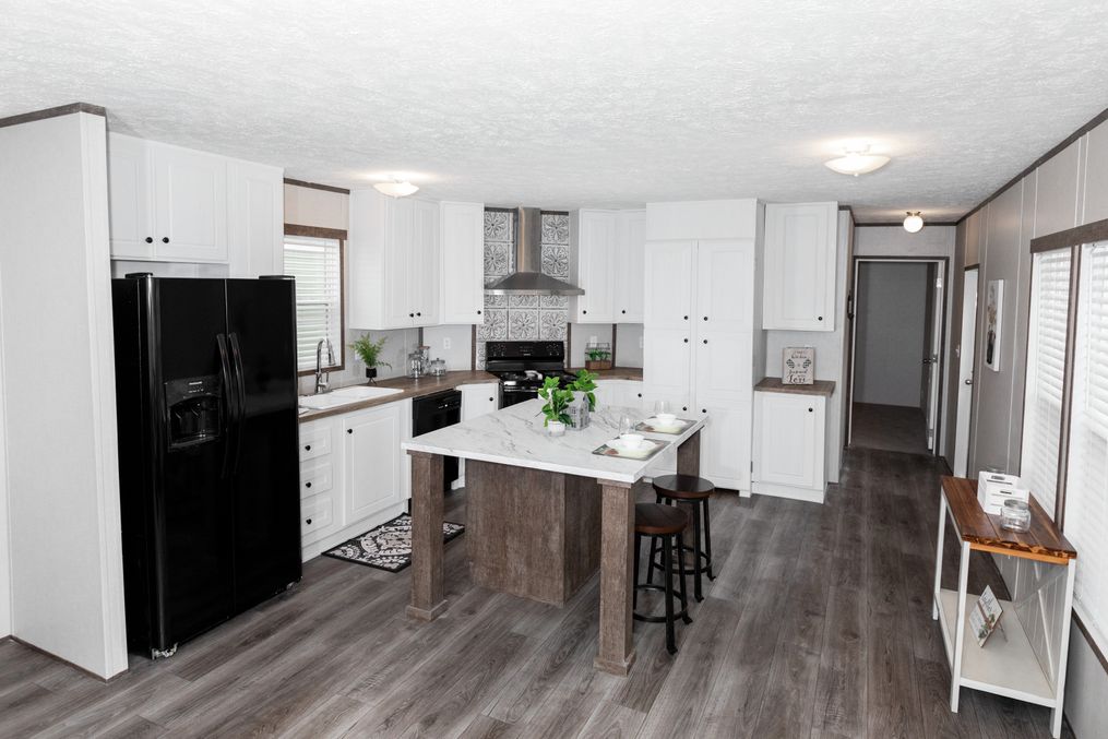 The BLAZER 76 P Kitchen. This Manufactured Mobile Home features 3 bedrooms and 2 baths.