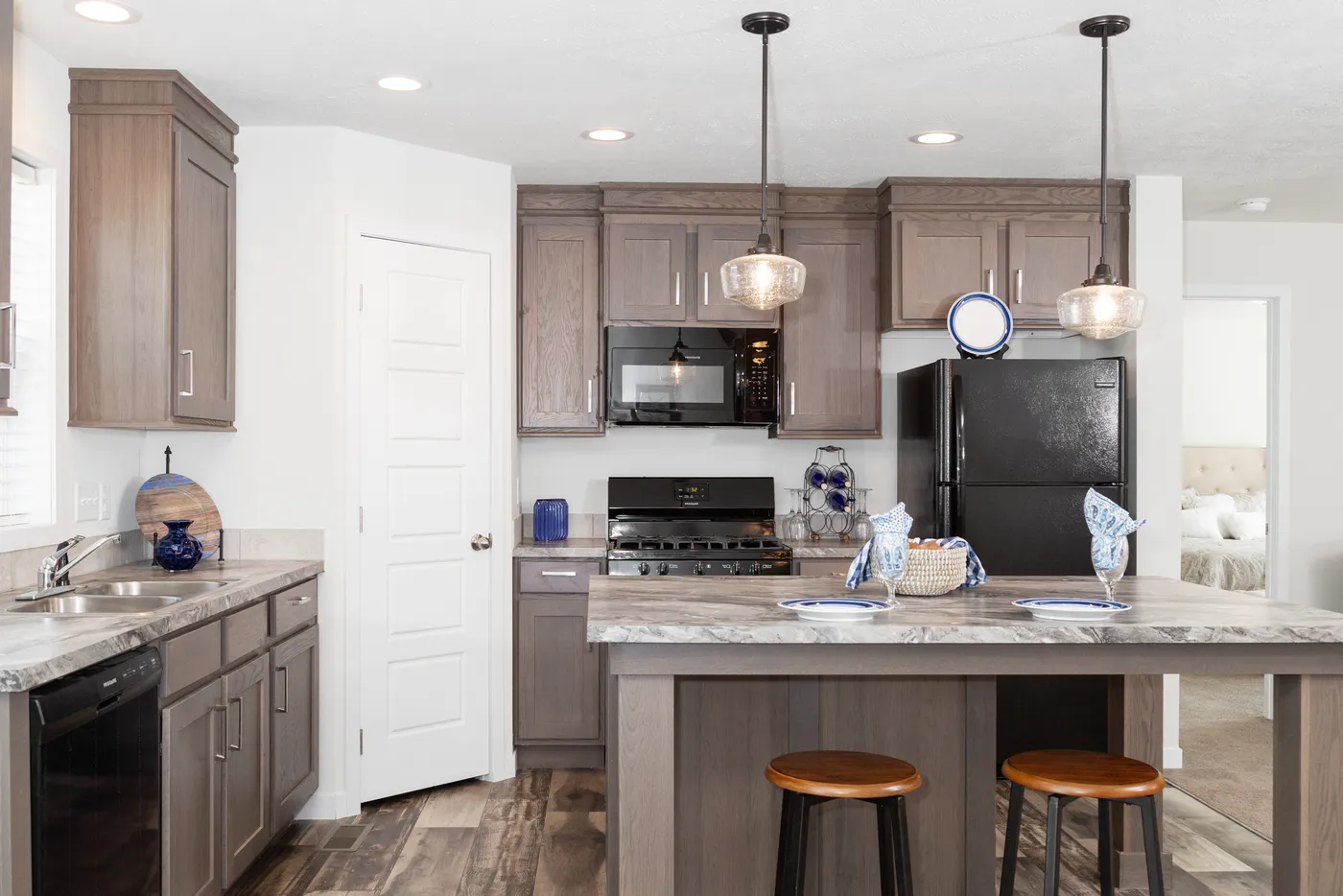 The SOMERSET DR 5228-MS012 SECT Kitchen. This Manufactured Mobile Home features 3 bedrooms and 2 baths.