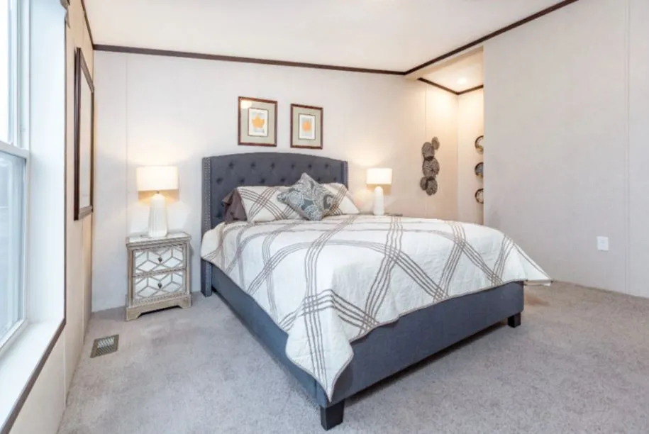 The ZIRCON Primary Bedroom. This Manufactured Mobile Home features 3 bedrooms and 2 baths.
