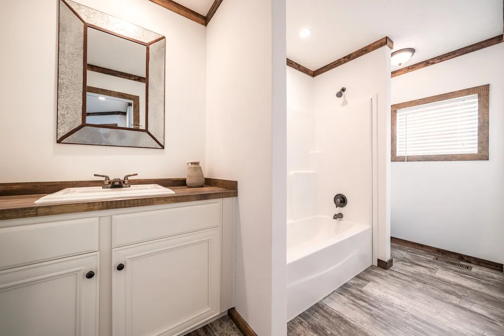 The THE AVALYN Primary Bathroom. This Manufactured Mobile Home features 3 bedrooms and 2 baths.