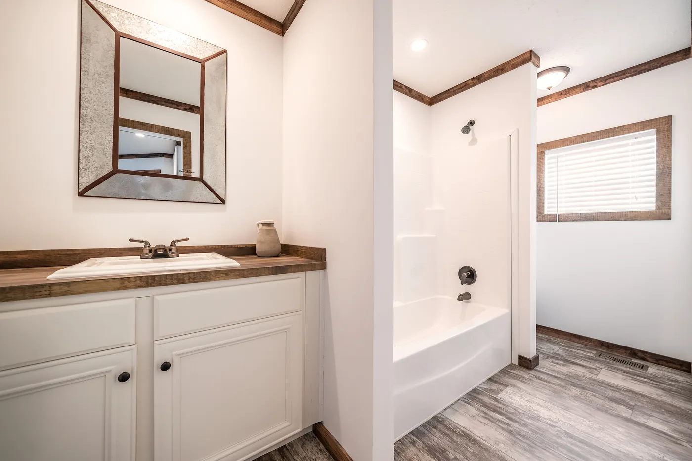 The THE AVALYN Primary Bathroom. This Manufactured Mobile Home features 3 bedrooms and 2 baths.