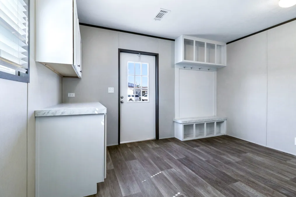 The ABSOLUTE VALUE Utility Room. This Manufactured Mobile Home features 4 bedrooms and 2 baths.