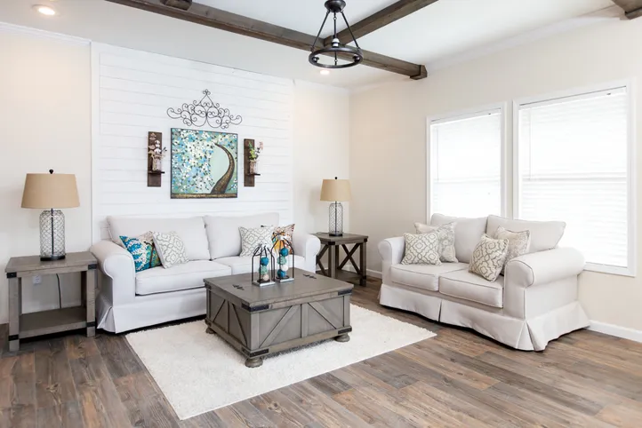 The SOUTHERN CHARM Living Room. This Manufactured Mobile Home features 3 bedrooms and 2 baths.