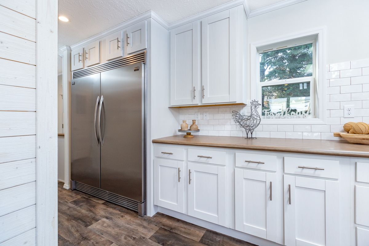 The FREEDOM 427 Kitchen. This Manufactured Mobile Home features 3 bedrooms and 2.5 baths.