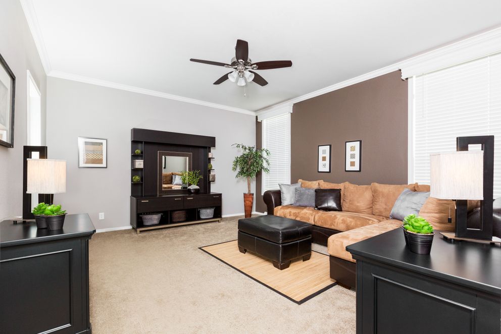 The ENCHANTMENT 3070A Living Room. This Manufactured Mobile Home features 3 bedrooms and 2 baths.